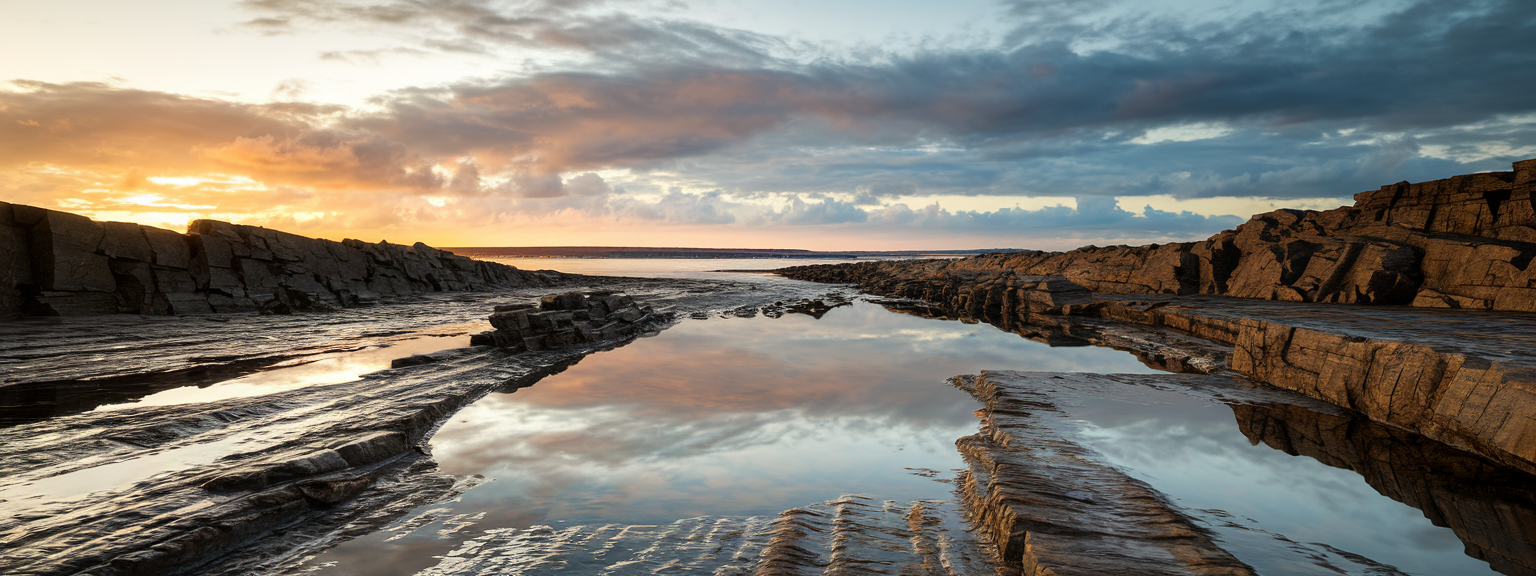 Golden hour wide-angle view of a mountain lake for landscape photography